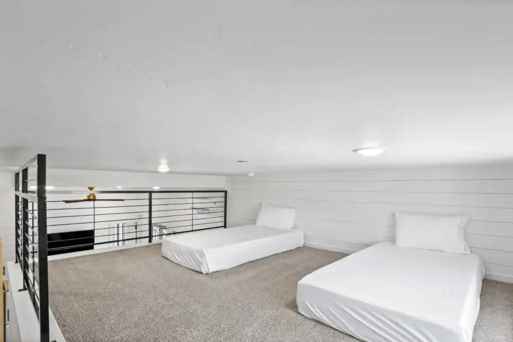 Spacious modular home interior with two beds and modern design.