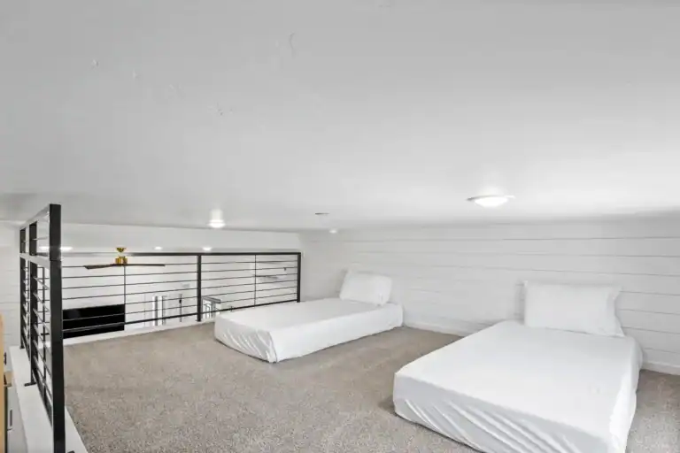 Spacious modular home interior with two beds and modern design.