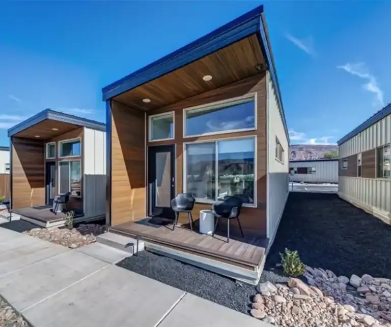 Contemporary Zip Kit Homes with large windows and wooden accents.