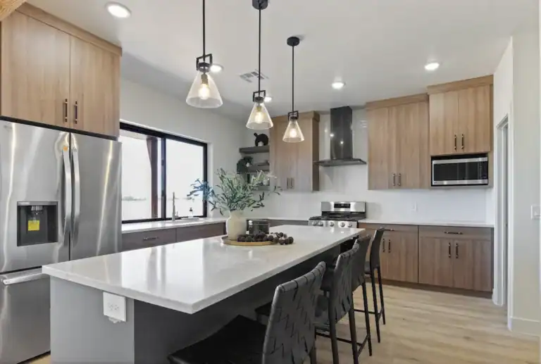 Contemporary kitchen with wooden cabinets and island for Zip Kit Homes.