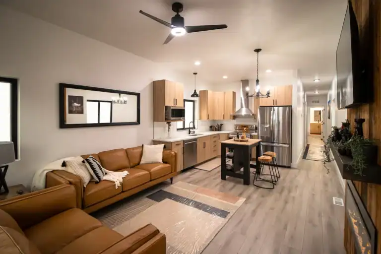 Modern kitchen with wooden cabinets and stainless steel appliances.