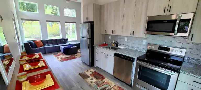 Zip Kit Homes kitchen and living area under the Big Sky.