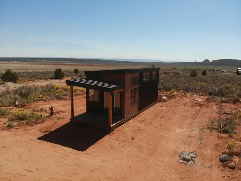 Contemporary Zip Kit modular home on a cleared plot of land.