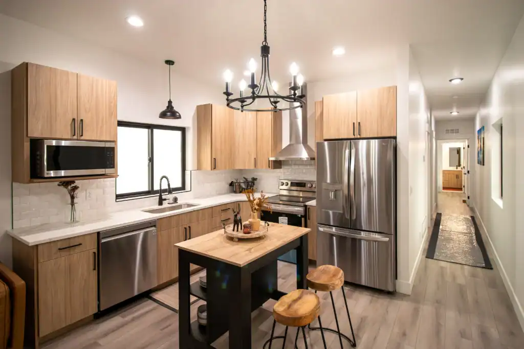 Contemporary kitchen with wooden cabinets and stainless steel appliances.