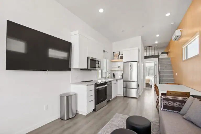 Bright, open-plan modular home interior with kitchen and living area.