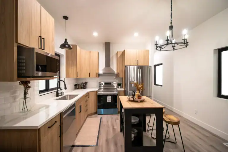 Contemporary Zip Kit Homes with wooden siding and large windows.