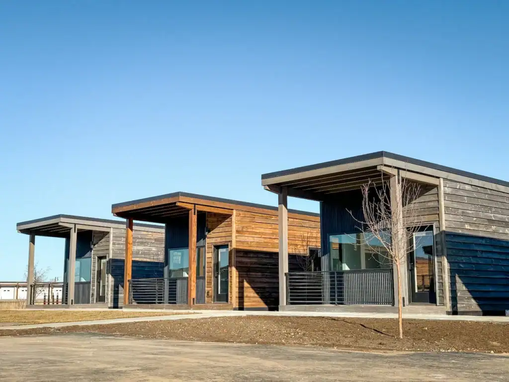 Modern Zip Kit Homes with sleek design and large windows in a suburban setting.