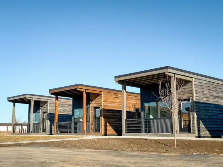 Modern Zip Kit Homes with sleek design and large windows in a suburban setting.