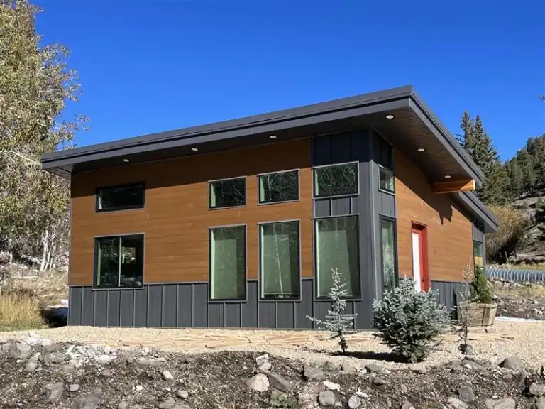 Zip Kit Home in Big Sky with contemporary design and large windows.