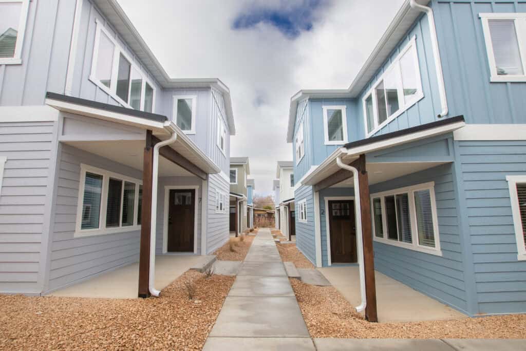 Modern blue Zip Kit Homes in Clyde with contemporary design and large windows.
