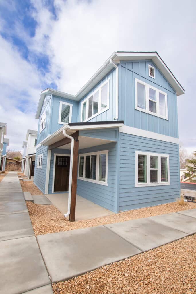 Zip Kit Home in Clyde with blue exterior and large windows.