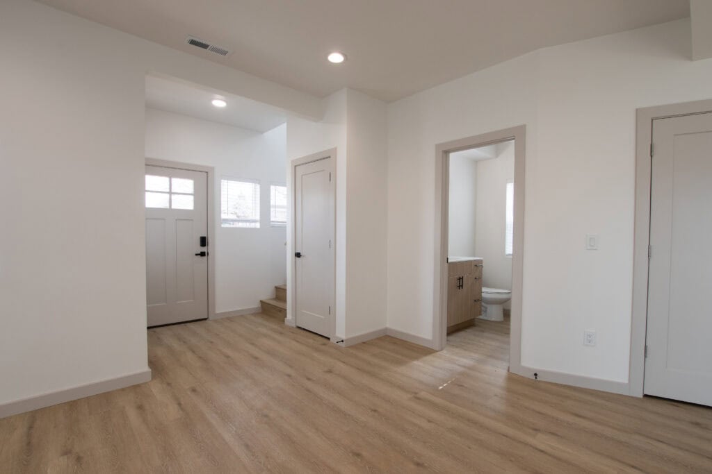 Bright, open interior of the Clyde tiny home with natural light and minimalist design.