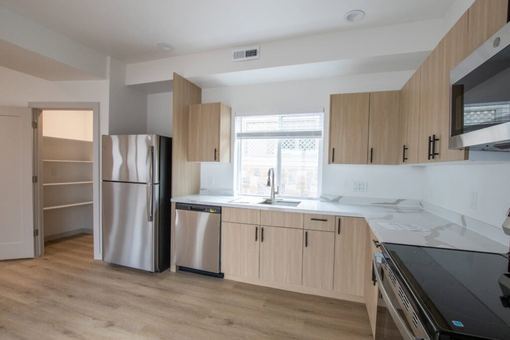 Zip Kit Homes Clyde kitchen with stainless steel appliances.