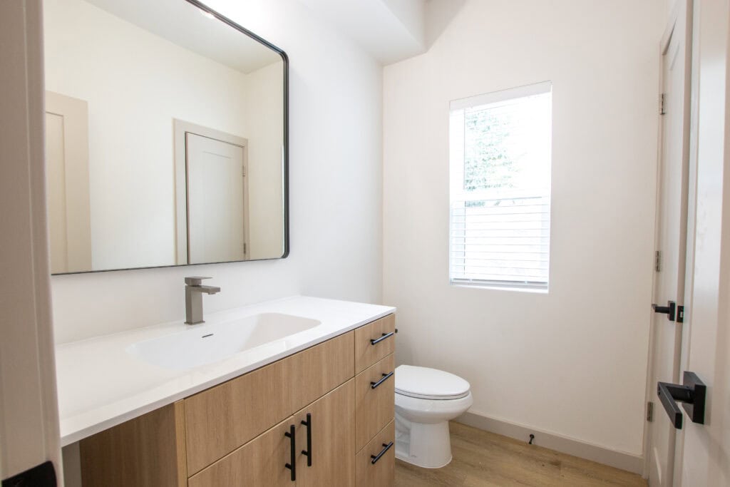 Modern Clyde tiny home bathroom with minimalist design and natural light.
