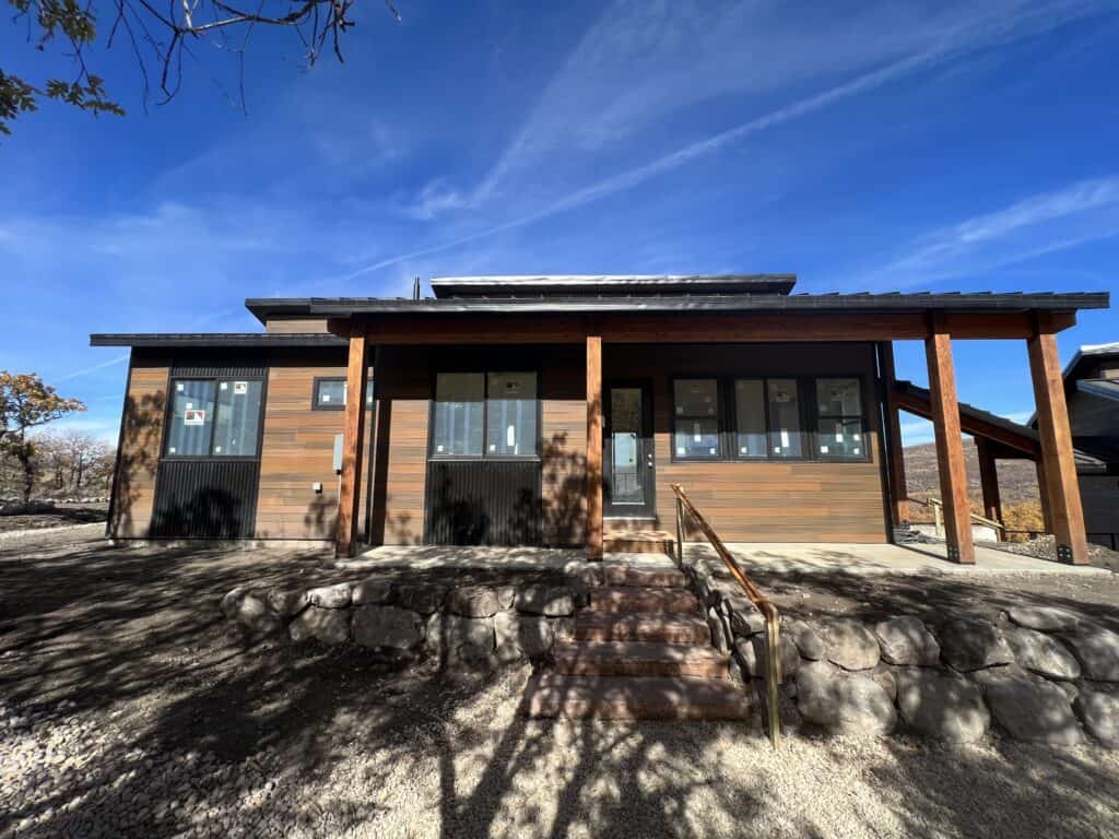 Moab home front porch with wood siding and modern roofline.