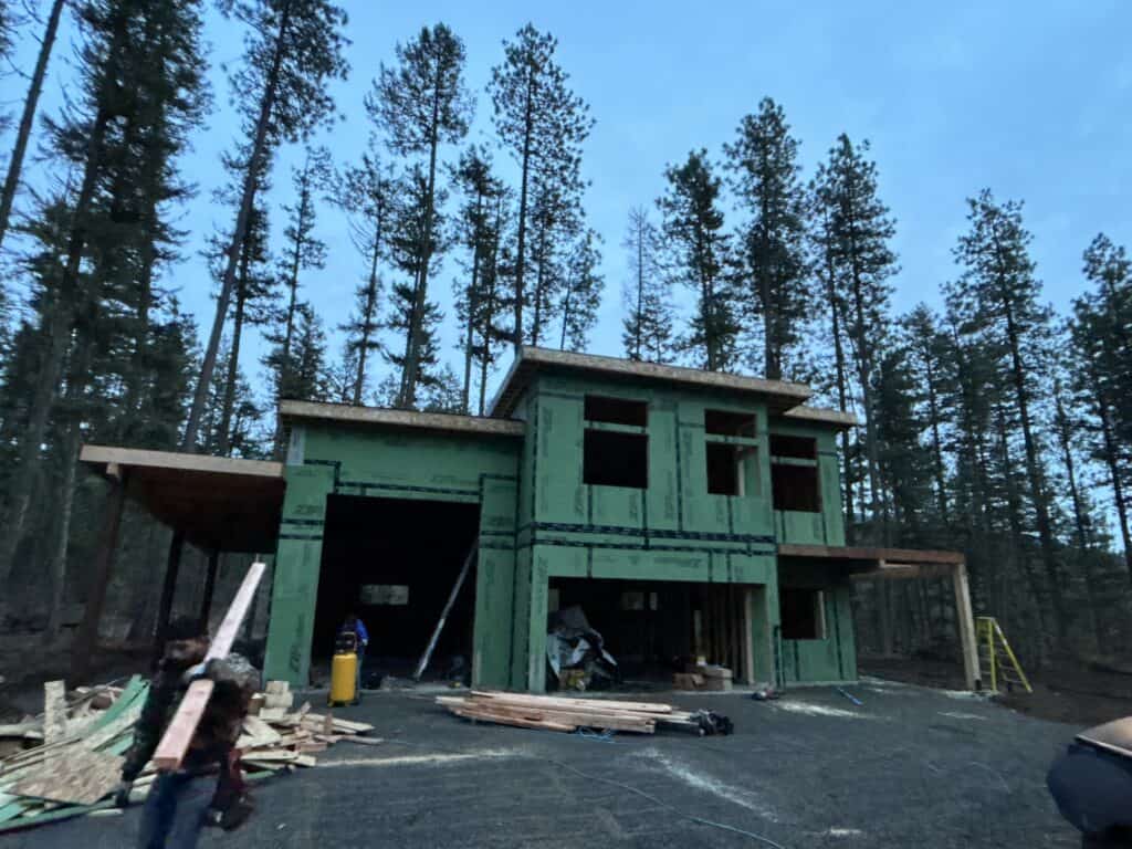 Koda home under construction in a wooded Northern Idaho setting.