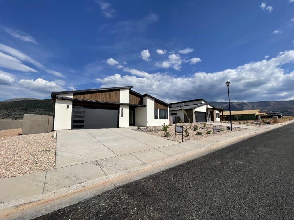 Contemporary Zip Kit home with sleek design and spacious driveway.