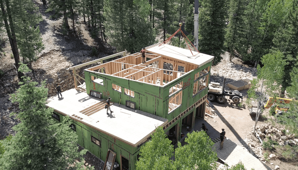 Bozeman home by Zip Kit Homes under construction with framing and roof panel installation.