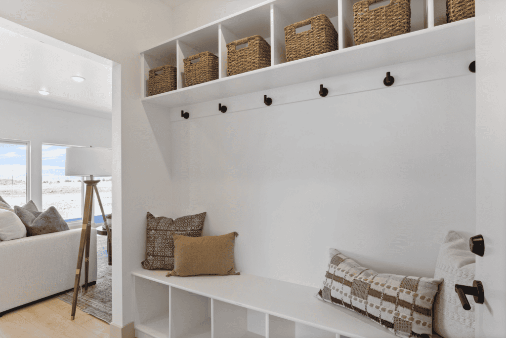 Oakley mudroom with built-in bench, hooks, and overhead storage baskets