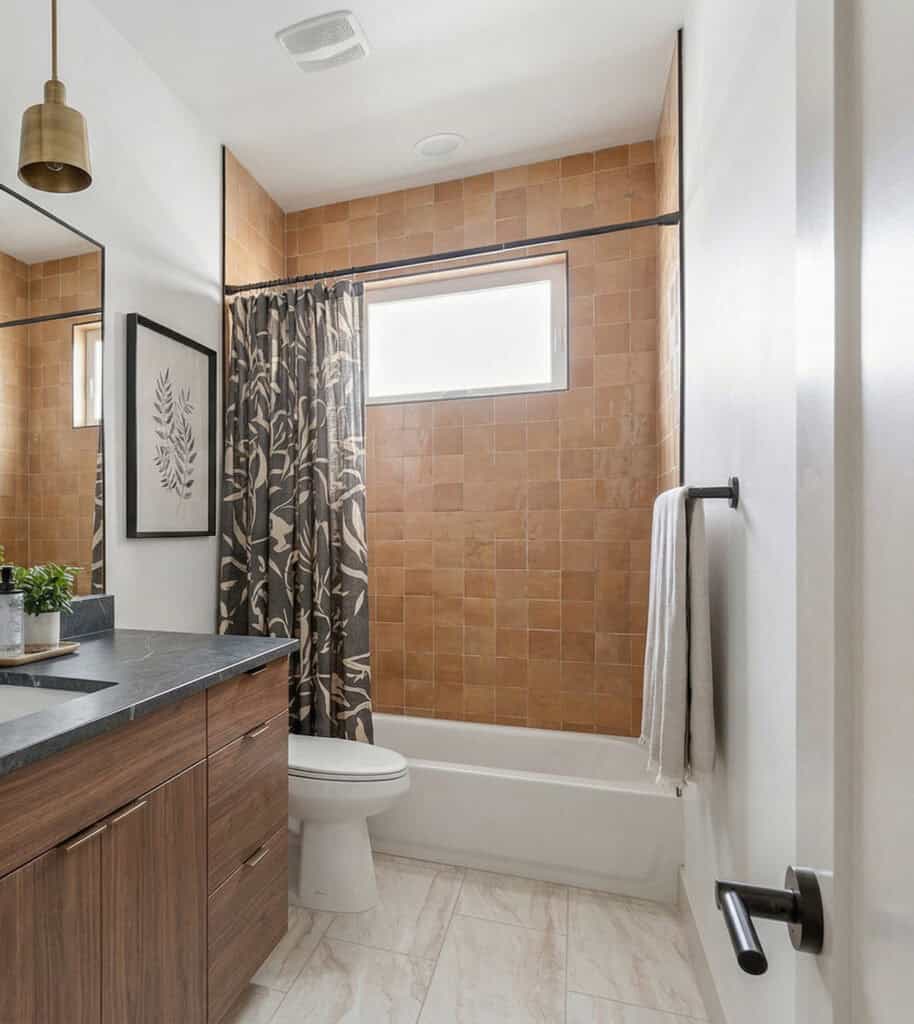 Oakley bathroom with modern vanity, clean tile finishes, and bright lighting