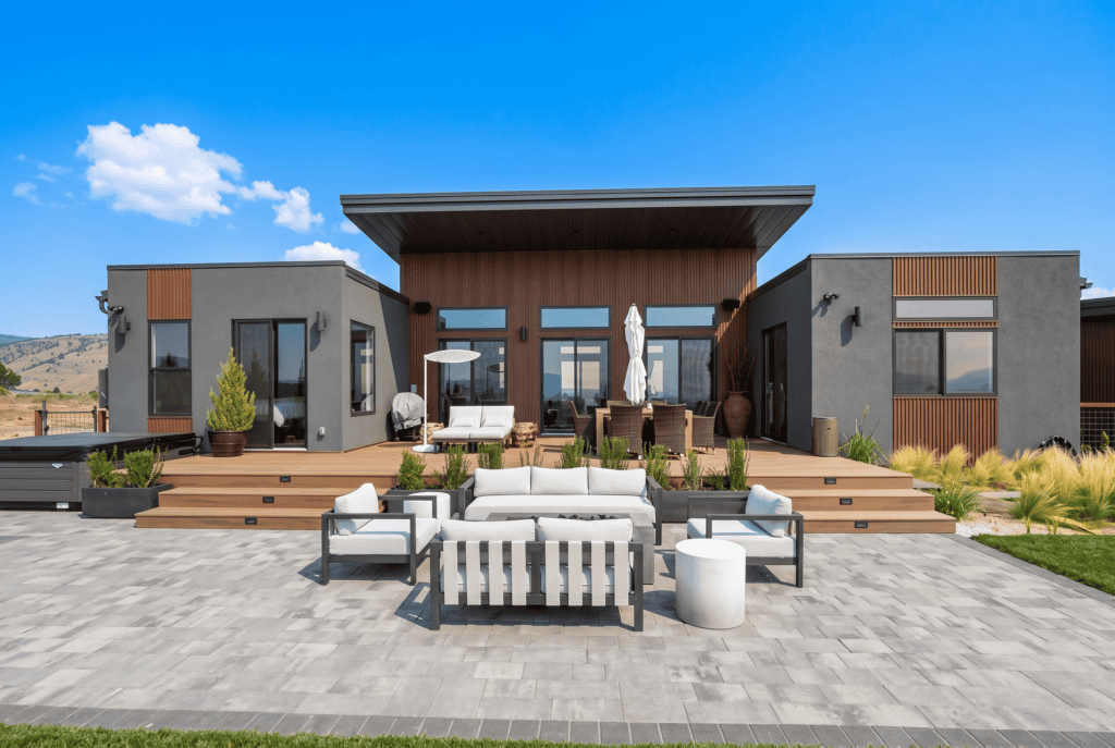 Alpine modern home with rear patio, large windows and indoor-outdoor living.