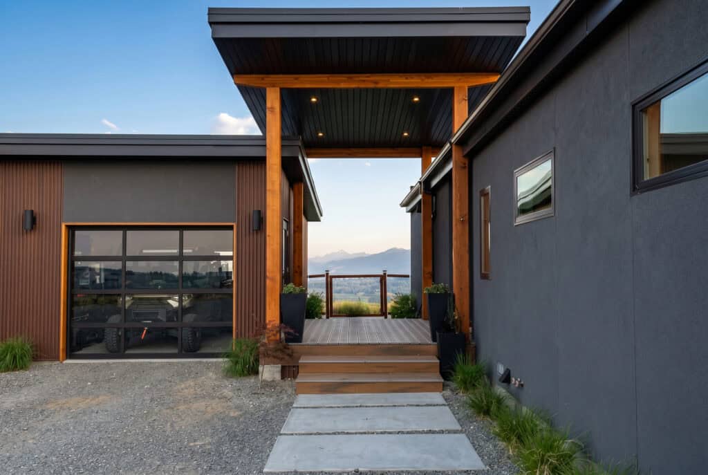 Alpine floor plan breezeway entry with wood beams and covered walkway.