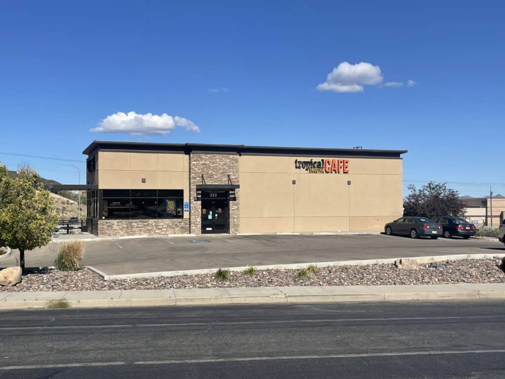 Zip Kit Homes retail store exterior with modern design and large windows.