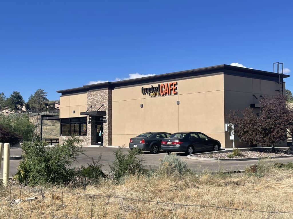 Zip Kit Homes retail store exterior with modern design and large windows.