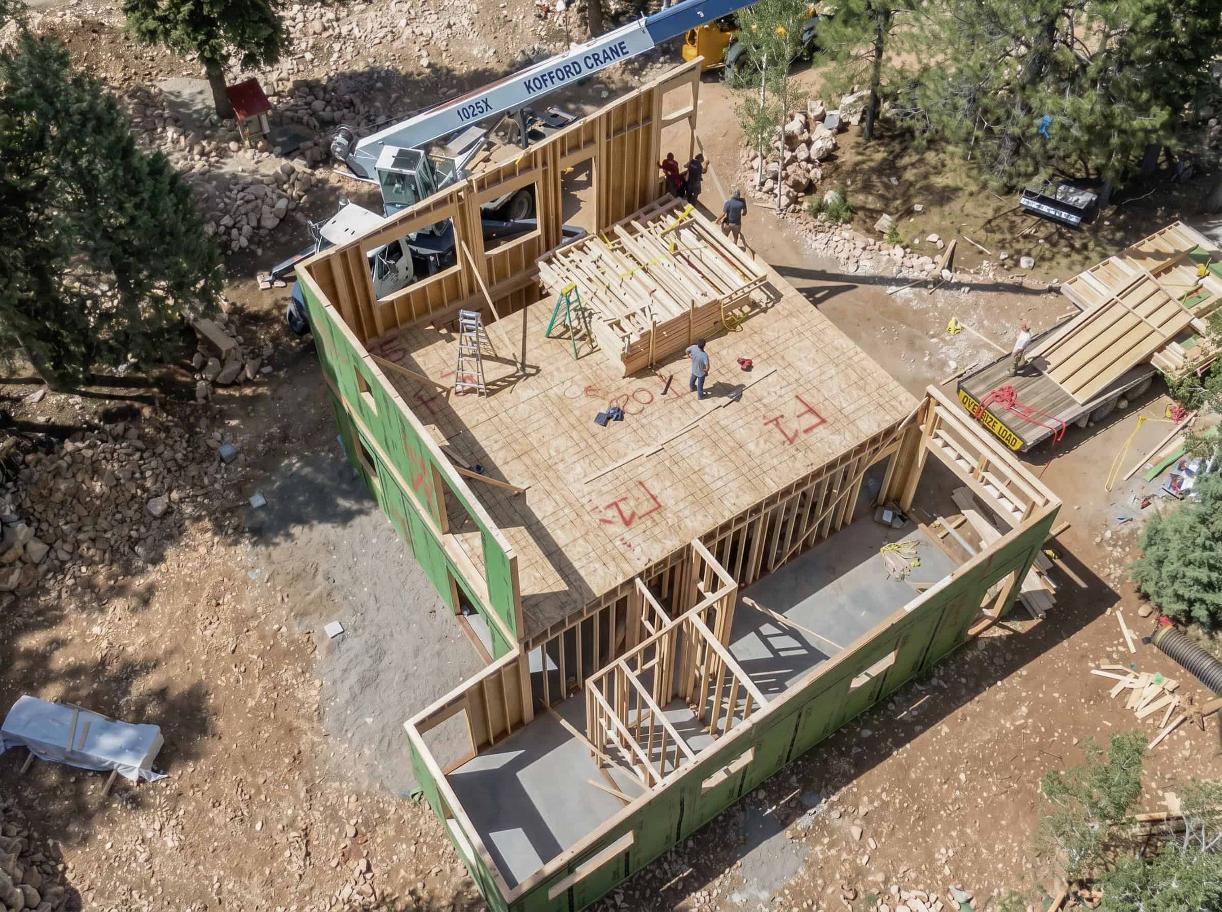 Bozeman custom home during construction in a mountain location with working setting walls.