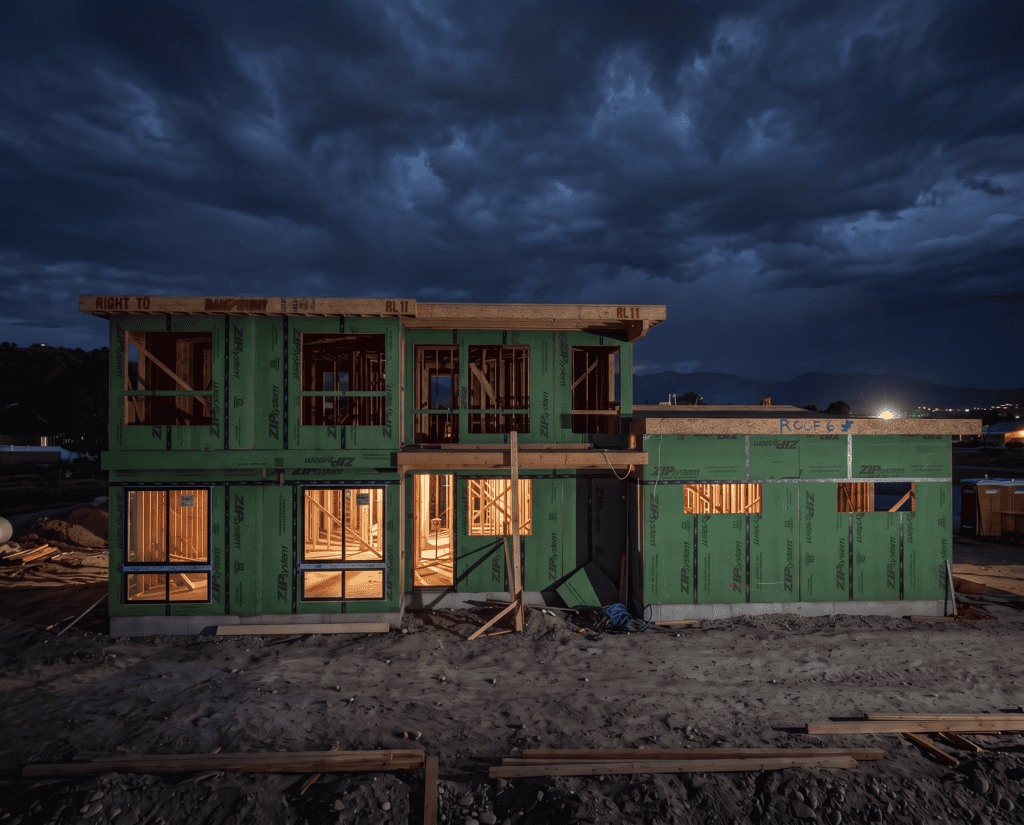 Unfinished Mountain Modern Home at Night called the Olympic by Zip Kit Homes