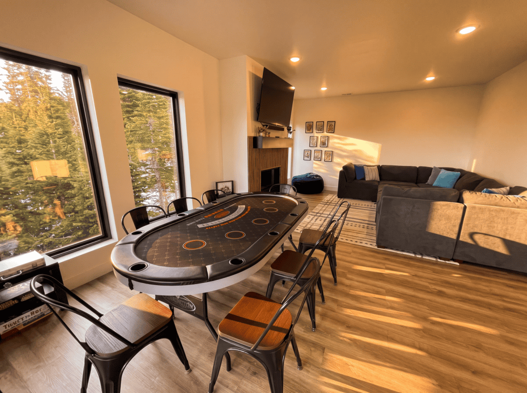 Spacious living and dining area in a Zip Kit home with large windows and cozy seating.